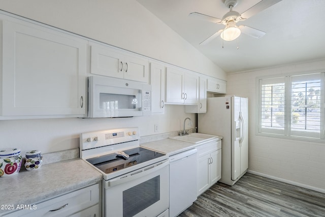 kitchen featuring lofted ceiling, sink, white cabinets, light hardwood / wood-style floors, and white appliances