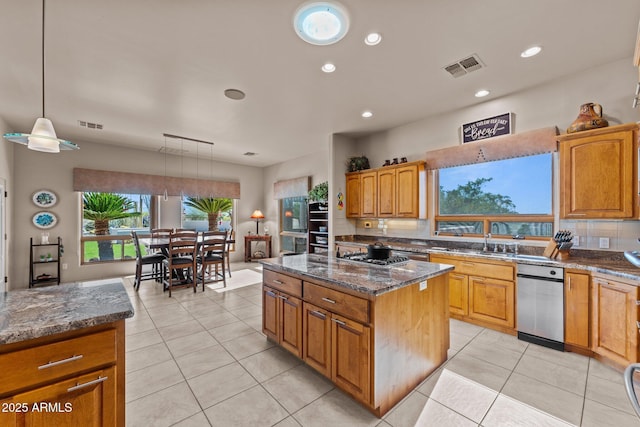 20910 W Cattle Iron Dr, Wickenburg, AZ 85390 - kitchen featuring a center island, dark stone countertops, decorative backsplash, a sink, and visible vents