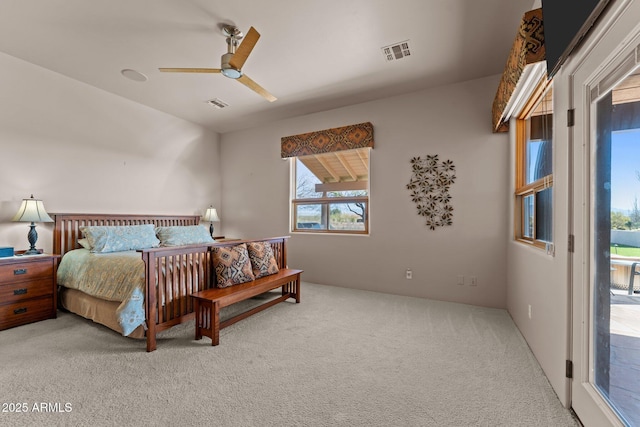 20910 W Cattle Iron Dr, Wickenburg, AZ 85390 - carpeted bedroom featuring access to exterior, visible vents, and a ceiling fan