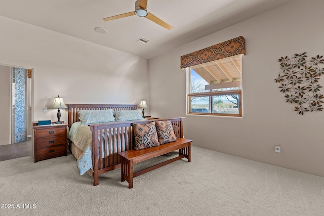 20910 W Cattle Iron Dr, Wickenburg, AZ 85390 - carpeted bedroom with ceiling fan and visible vents