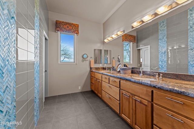 20910 W Cattle Iron Dr, Wickenburg, AZ 85390 - full bath with tile patterned floors, a sink, double vanity, and walk in shower