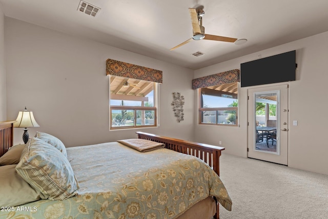 20910 W Cattle Iron Dr, Wickenburg, AZ 85390 - carpeted bedroom featuring access to exterior, multiple windows, and visible vents