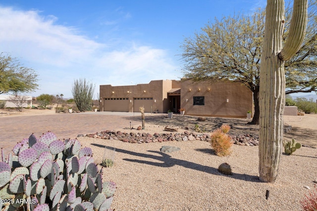 20910 W Cattle Iron Dr, Wickenburg, AZ 85390 - exterior space with driveway and an attached garage