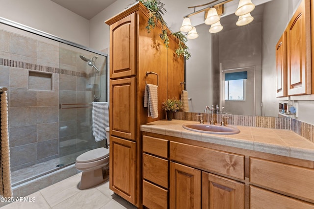 20910 W Cattle Iron Dr, Wickenburg, AZ 85390 - bathroom with toilet, vanity, tile patterned flooring, and a shower stall