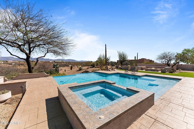 20910 W Cattle Iron Dr, Wickenburg, AZ 85390 - view of swimming pool featuring a pool with connected hot tub, a mountain view, and a patio