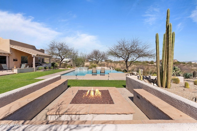 20910 W Cattle Iron Dr, Wickenburg, AZ 85390 - pool featuring an outdoor fire pit, a patio area, and a yard