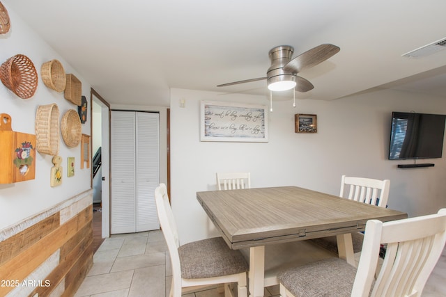 dining room featuring light tile patterned floors and ceiling fan