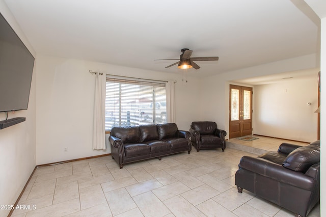 living room featuring light tile patterned floors and ceiling fan