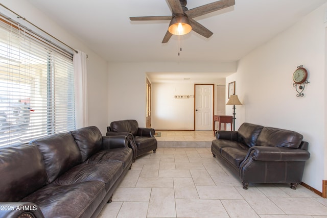 tiled living room with ceiling fan