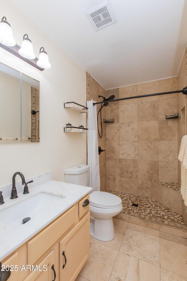 bathroom with a shower with curtain, vanity, and toilet