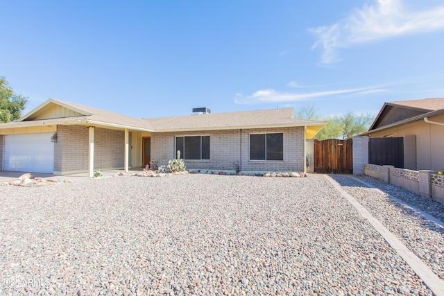 single story home featuring a garage