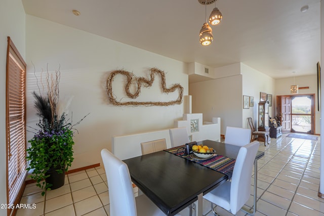 dining space with light tile patterned floors