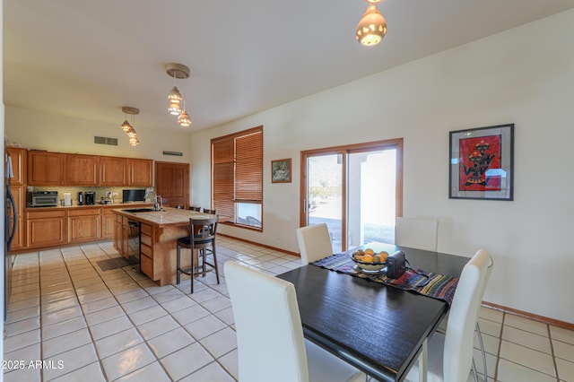 tiled dining space with sink