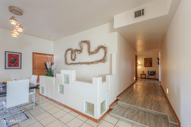 corridor featuring light hardwood / wood-style floors