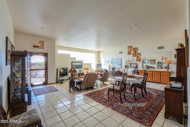 dining area with light tile patterned floors