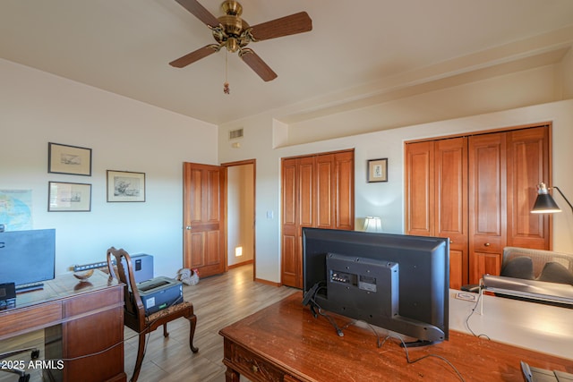 home office with ceiling fan and light hardwood / wood-style floors