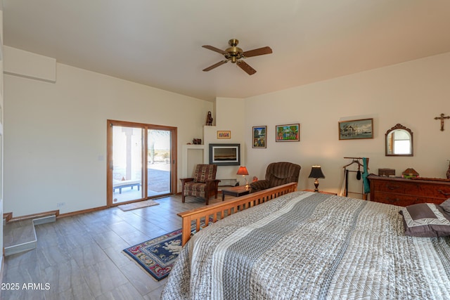 bedroom with access to exterior and ceiling fan