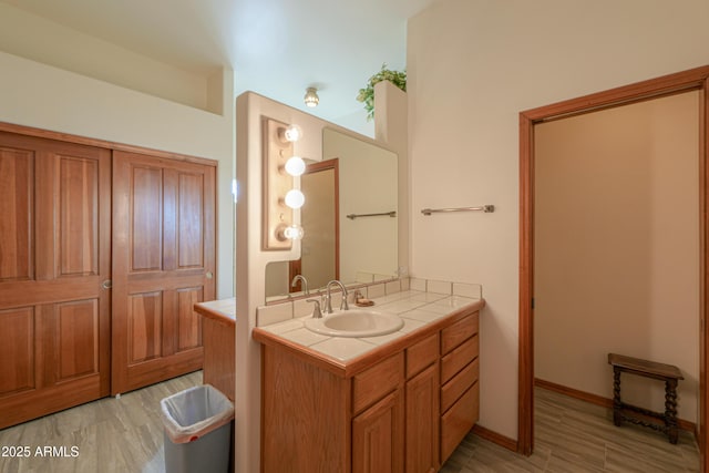 bathroom with vanity and hardwood / wood-style floors