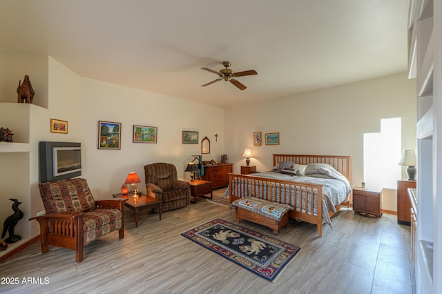 bedroom with ceiling fan and light wood-type flooring