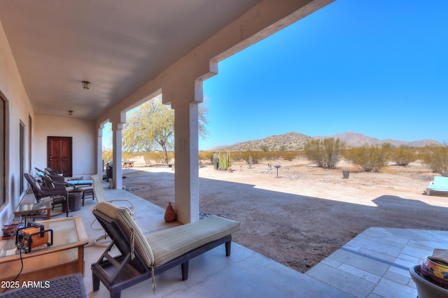 view of patio featuring a mountain view