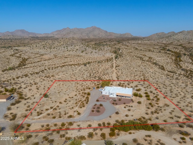 birds eye view of property featuring a mountain view