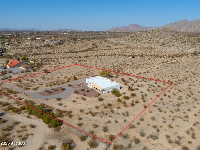 birds eye view of property featuring a mountain view