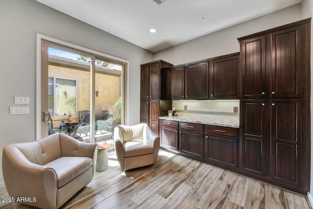 sitting room featuring light wood finished floors and recessed lighting