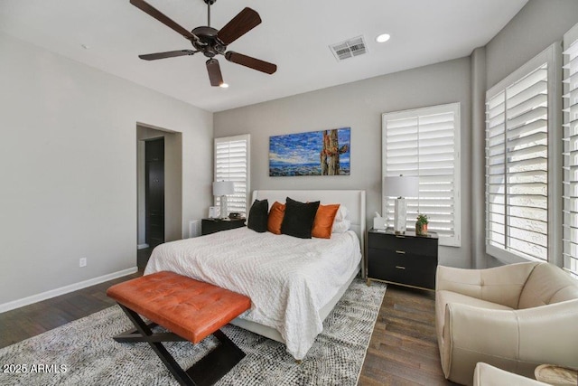 bedroom with visible vents, recessed lighting, baseboards, and wood finished floors