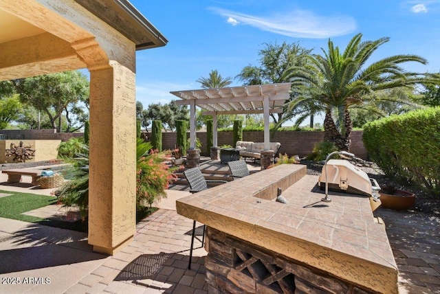 view of patio with grilling area, an outdoor hangout area, a pergola, and a fenced backyard