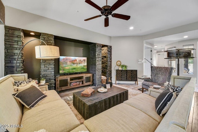 living area featuring wood finished floors, recessed lighting, and a ceiling fan