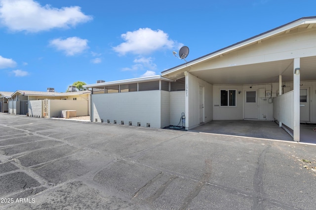 exterior space with an attached carport
