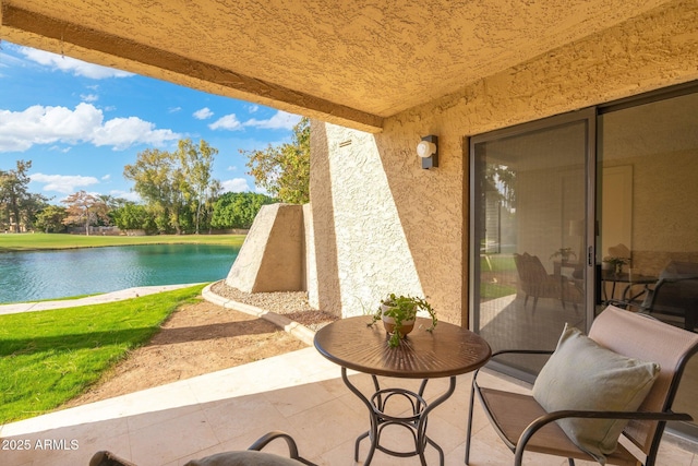 view of patio featuring a water view