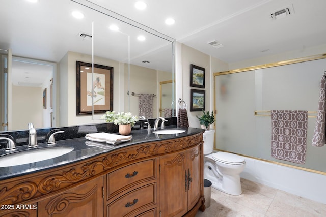 full bathroom with vanity, toilet, and combined bath / shower with glass door