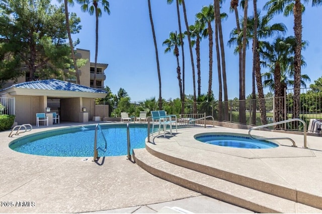 view of swimming pool featuring a patio area and a community hot tub