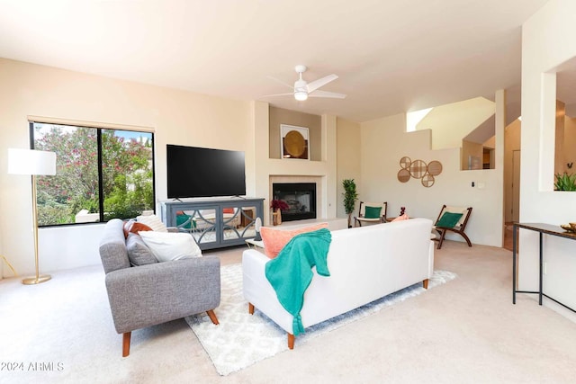 living room featuring light carpet and ceiling fan