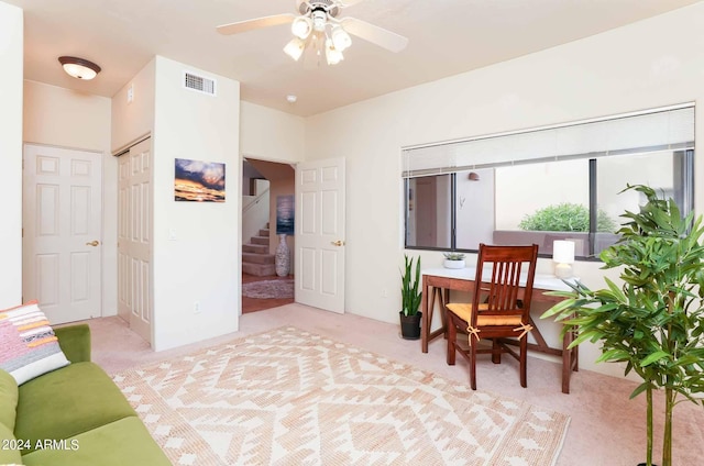 office with ceiling fan and light carpet