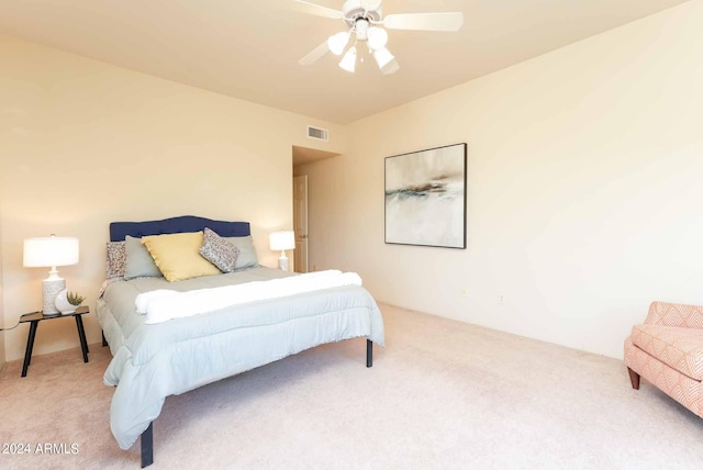 bedroom featuring ceiling fan and carpet