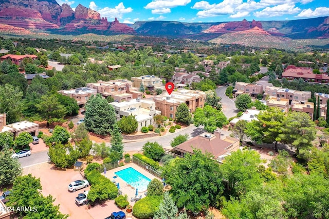 birds eye view of property with a mountain view