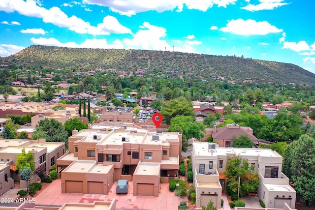 birds eye view of property with a mountain view