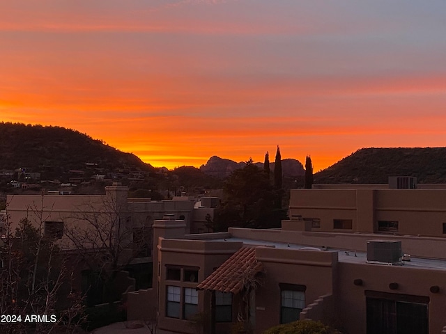 property's view of city featuring a mountain view