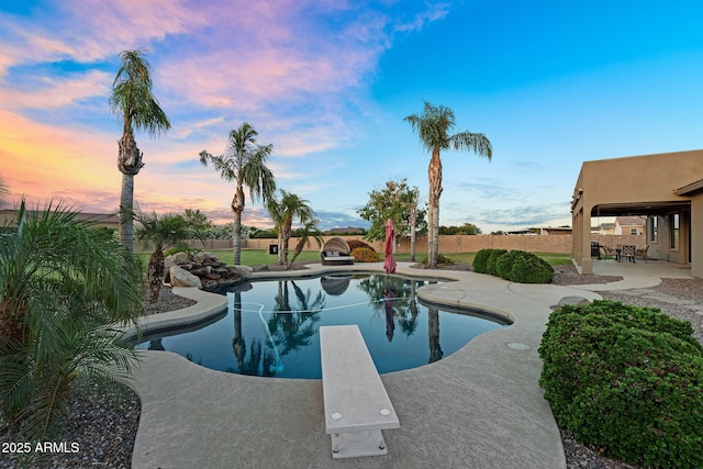 18822 E Flintlock Dr, Queen Creek, AZ 85142 - view of swimming pool with a patio, a diving board, a fenced backyard, and a fenced in pool