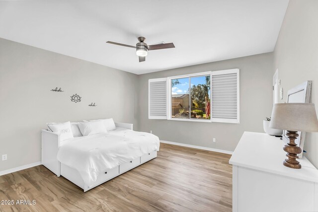 18822 E Flintlock Dr, Queen Creek, AZ 85142 - bedroom featuring light wood-style floors, baseboards, and a ceiling fan