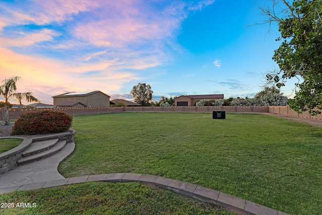 18822 E Flintlock Dr, Queen Creek, AZ 85142 - yard at dusk with a fenced backyard