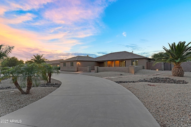 18822 E Flintlock Dr, Queen Creek, AZ 85142 - prairie-style house with curved driveway and a fenced front yard