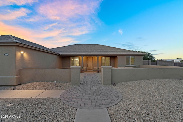18822 E Flintlock Dr, Queen Creek, AZ 85142 - view of front facade with a fenced front yard and stucco siding