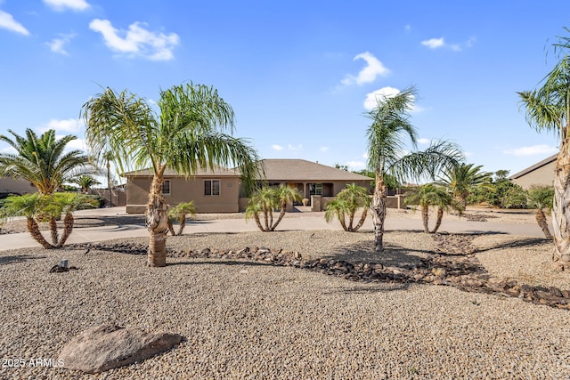 18822 E Flintlock Dr, Queen Creek, AZ 85142 - view of front of home featuring concrete driveway, fence, and stucco siding