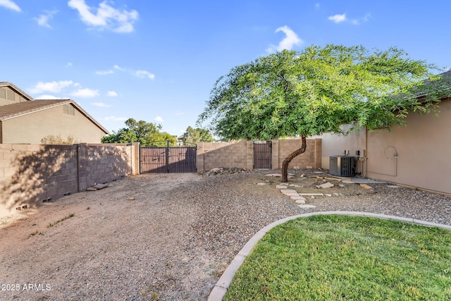 18822 E Flintlock Dr, Queen Creek, AZ 85142 - view of yard with central AC, fence, and a gate
