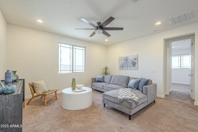 living area with visible vents, baseboards, carpet floors, recessed lighting, and a ceiling fan