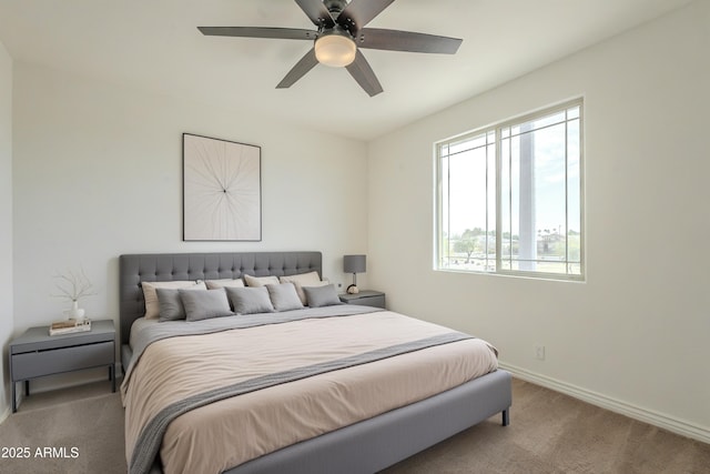 bedroom with carpet flooring, baseboards, and ceiling fan