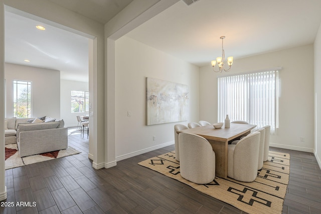 dining area with visible vents, baseboards, recessed lighting, dark wood-style floors, and a notable chandelier